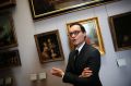 Head of the paintings department at the Louvre museum, Sebastien Allard, with paintings looted by Nazis during World War ...