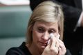 Labor MP Susan Lamb wipes away tears after delivering a statement on her citizenship after Question Time at Parliament ...