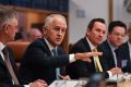 Prime Minister Malcolm Turnbull sits next to WA Premier Mark McGowan at the COAG meeting.