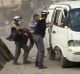 A civil defence worker carrying a victim after airstrikes hit a rebel-held suburb near Damascus on  Thursday.