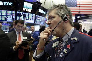 Trader John Panin, right, works on the floor of the New York Stock Exchange, Friday, Feb. 9, 2018