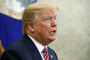 President Donald Trump speaks during a meeting with campaign volunteer Shane Bouvet, in the Oval Office of the White House, Friday, Feb. 9, 2018, in Washington.