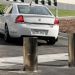 A Comcar enters the grounds of Parliament House by driving past drives past retractable bollards.