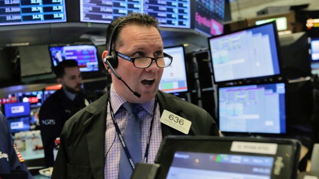 Trader Edward Curran works on the floor of the New York Stock Exchange.