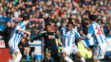 AFC Bournemouth's Jordon Ibe, center left, and Huddersfield Town's Rajiv van La Parra battle for the ball during their ...