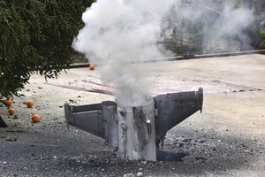 Smoke rise from a missile, which according to the Lebanon national news agency appears to be part of a Syrian air defense missile targeting an Israeli warplane which landed in a lemon grove, in Hasbani village, southwest Lebanon, Saturday, Feb. 10, 2018.