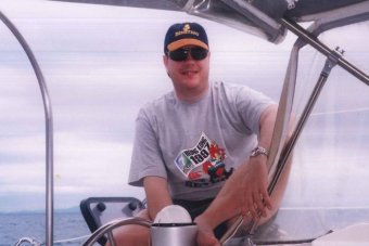 Tim Nicholls sits on a boat's deck in the Whitsundays in north Queensland on a bareback charter in 1994.