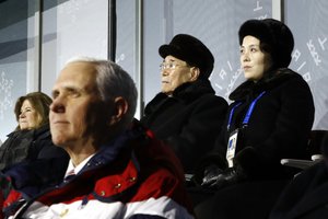 Kim Yo Jong, top right, sister of North Korean leader Kim Jong Un, sits alongside Kim Yong Nam, president of the Presidium of North Korean Parliament, and behind U.S. Vice President Mike Pence as she watches the opening ceremony of the 2018 Winter Olympics in Pyeongchang, South Korea, Friday, Feb. 9, 2018.