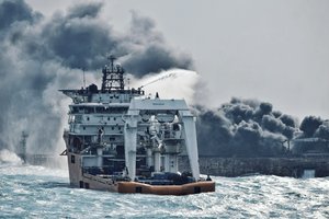 File - In this Jan. 10, 2018 photo provided by China's Ministry of Transport, a firefighting boat works to put on a blaze on the oil tanker Sanchi in the East China Sea off the eastern coast of China.