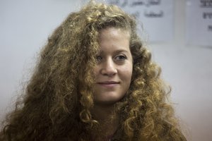 Palestinian protest icon Ahed Tamimi is in a courtroom at the Ofer military prison near Jerusalem, Tuesday, Feb. 13, 2018.