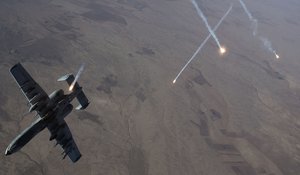 File - Countermeasures streak through the sky as an Air Force A-10 Thunderbolt II assigned to the 74th Expeditionary Fighter Squadron departs after refueling from a KC-135 Stratotanker over Syria, Dec. 1, 2017.