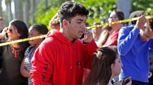 Students released from a lockdown are overcome with emotion following following a shooting at Marjory Stoneman Douglas ...