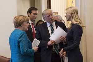 President Donald Trump talks with German Chancellor Angela Merkel, Friday, March 17, 2017, in the outer Oval Office, joined by Senior White House ouseHouseAdvisor Jared Kushner and Ivanka Trump, at the White House in Washington, D.C.