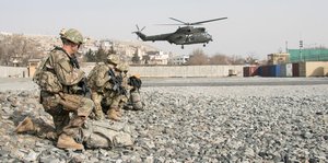 U.S. and British coalition partners and Afghan security forces train together in an aerial reaction force exercise utilizing British helicopter assets at Camp Qargha in Kabul, Afghanistan, Jan. 16, 2018.