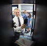 McKinnon students Xavier, Catherine and Louisa put their phones in their lockers. 