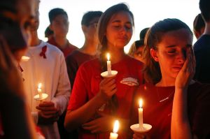 Students grieve at a vigil held for the victims of the school shooting at Parkland, Florida.