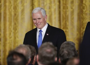 Vice President Mike Pence arrives for a news conference with President Donald Trump and Australian Prime Minister Malcolm Turnbull in the East Room of the White House in Washington, Friday, Feb. 23, 2018.