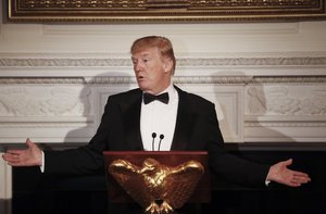 President Donald Trump makes remarks during the Governors' Ball in the State Dining Room of the White House in Washington, Sunday, Feb. 25, 2018.