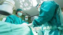 Surgeon operates on patient - 