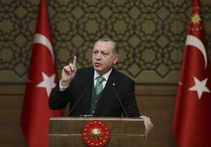 Turkey's President Recep Tayyip Erdogan talks during an event in Ankara, Turkey, Thursday, Feb. 22, 2018.