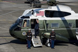 File - President Donald J. Trump waves good-buy as he boards Marine One after a Troop Talk, Nov. 5, 2017, at Yokota Air Base, Japan. President Trump left Yokota to meet with Japanese Prime Minister, Shinzo Abe, and other Japanese leadership.