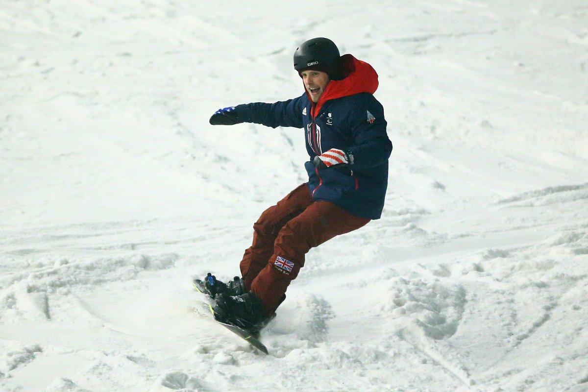 James Barnes-Miller para snowboards with a huge smile on his face