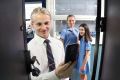 McKinnon students Xavier Verdnik (16), Catherine Braniska (14) and Louisa D'Ambra (13) have to lock their phones away in ...