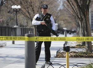 Law enforcement officer at Pennsylvania Ave., near the White House in Washington, after the are was closed to pedestrian traffic, Saturday, March 3, 2018.