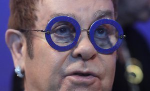 British musician Elton John waits for the beginning of the ceremony for the Crystal Awards