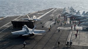 Sailors conduct fight operations on the flight deck of the Nimitz-class aircraft carrier USS Carl Vinson, South China Sea, 23 February, 2018.