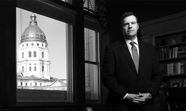 Kris Kobach photographed in front of a capital building