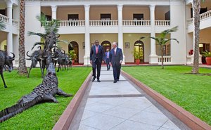 U.S. Secretary of State Rex Tillerson walks with Kenyan President Uhuru Kenyatta on the State House lawn in Nairobi, Kenya on March 9, 2018.