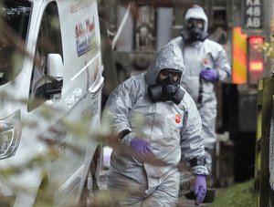 Military forces work on a van in Winterslow, England, Monday, March 12, 2018, as investigations continue into the nerve-agent poisoning of Russian ex-spy Sergei Skripal and his daughter Yulia, in Salisbury, England, on Sunday March 4, 2018.