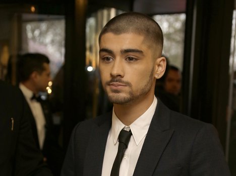 Zayn Malik poses for photographers upon arrival at The Asian Awards in central London, Friday, 17 April, 2015.