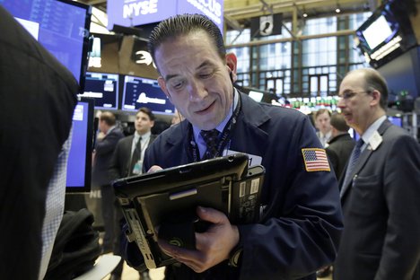 Trader Tommy Kalikas works on the floor of the New York Stock Exchange, Thursday, March 15, 2018