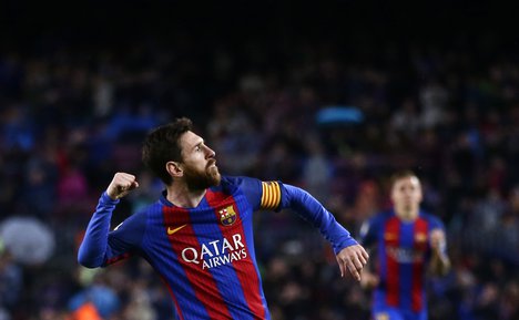 FC Barcelona's Lionel Messi celebrates after scoring during the Spanish La Liga soccer match between FC Barcelona and Osasuna at the Camp Nou stadium in Barcelona, Spain