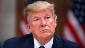 President Donald Trump listens during a dinner with European business leaders at the World Economic Forum, Thursday, ...