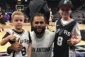 San Antonio Spurs NBA player Patty Mills greeting Luke Allen after winning a competition for his Game Day! book