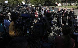 Interim Austin police chief Brian Manley, at podium, stands with ATF Special Agent in Charge Fred Milanowski, FBI Special Agent in Charge Christopher Combs, and Assistant police chief Troy Gay during a news conference near the site of Sunday's explosion, Monday, March 19, 2018, in Austin, Texas.