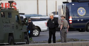 Officials investigate the scene where a suspect in a series of bombing attacks in Austin blew himself up early Wednesday as authorities closed in, Wednesday, March 21, 2018, in Round Rock, Texas.