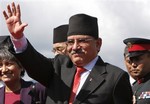 Nepal's Prime Minister Pushpa Kamal Dahal Prachanda, waves upon his arrival at the airport in Katmandu, Nepal, Thursday, Sept. 18, 2008. Prachanda returned home Thursday after a five-day official visit to India calling it a "successful visit."