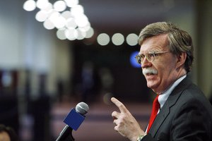 File - John R. Bolton, Permanent Representative of the United States to the United Nations, briefs correspondents after Security Council consultations on Côte d'Ivoire, at UN Headquarters in New York, 1 November, 2006.