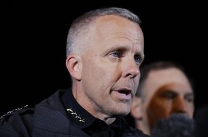 Interim Austin Police Chief Brian Manley, right, briefs the media, Wednesday, March 21, 2018, in Round Rock, Texas.