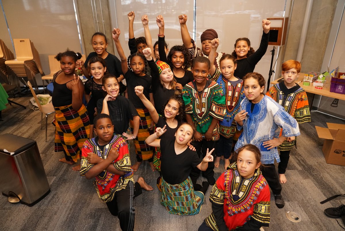 Students from Roses in Concrete Community School pose together.