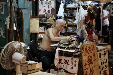 A scene at the Jade market in Hong Kong, still using a typewriter for business.