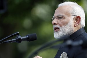 Indian Prime Minister Narendra Modi speaks in the Rose Garden at the White House as President Donald Trump listens, Monday, June 26, 2017, in Washington.