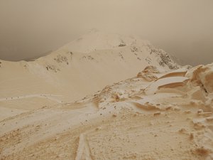 This handout photo taken on Friday, March 23, 2018, shows orangee snow in the mountains at the Rosa Khutor ski resort near Rosa Khutor, outside Sochi, Russia .