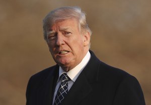 President Donald Trump walks across the South Lawn of the White House in Washington, Sunday, March 25, 2018, during his return from his Mar-a-Lago estate in Palm Beach, Fla.