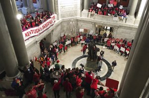 Hundreds of Kentucky teachers protest outside of Gov. Matt Bevin's office on Friday, March 30, 2018, in Frankfort, Ky.