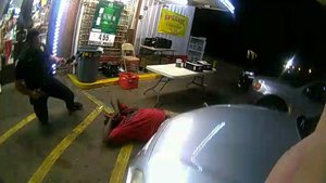 In this still image taken from security camera video provided Friday, March 30, 2018, by the Baton Rouge Police Department, a police officer stands near Alton Sterling after Sterling was shot during a struggle with police outside the Triple S Food Mart in Baton Rouge, La., in July 2016.